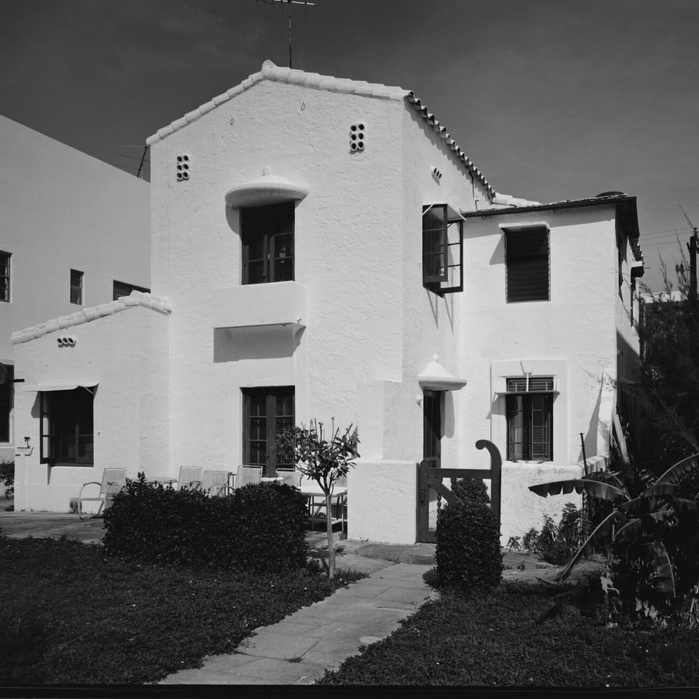 1409 Collins Avenue, Miami Beach: a two-story stucco house with a tile roof